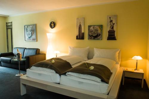 a bedroom with a large bed in a room at Hotel & Bildungszentrum Matt in Schwarzenberg