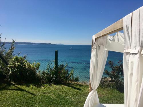 a white marquee with a view of the ocean at Hostal Casa Aurita Adults Only in Sanxenxo