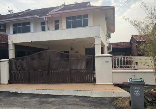 a house with a gate in front of it at New Casa De Monte in Melaka