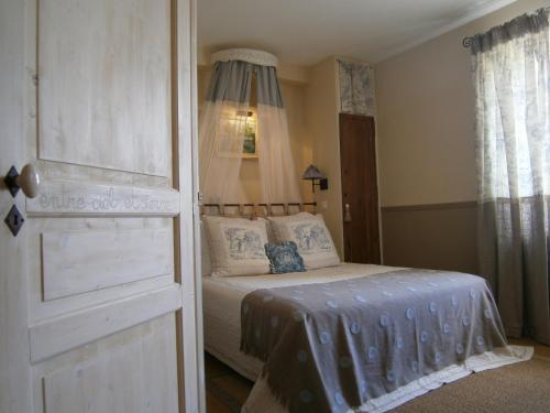 Voodi või voodid majutusasutuse Le Relais du Haras toas