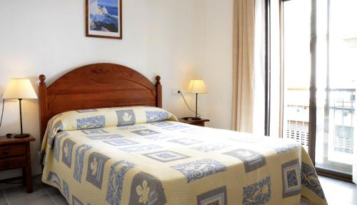 Postel nebo postele na pokoji v ubytování Hotel El Coloso