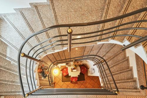 an overhead view of a spiral staircase in a building at Rooms & Restaurant Ostarija in Dolenjske Toplice