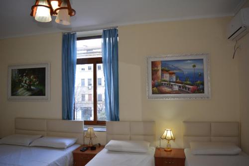 Postel nebo postele na pokoji v ubytování Hotel Republika