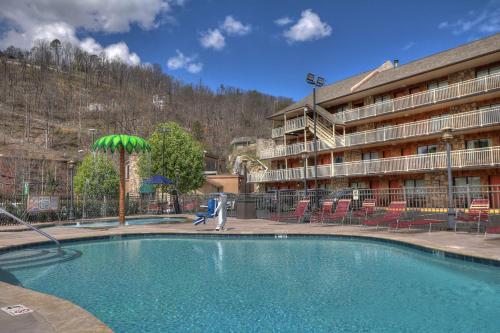 a large swimming pool in front of a hotel at Crossroads Inn & Suites in Gatlinburg