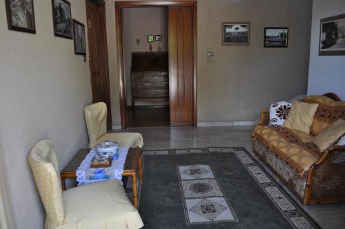 a living room with a couch and a table at L' Aia Antica in Veroli
