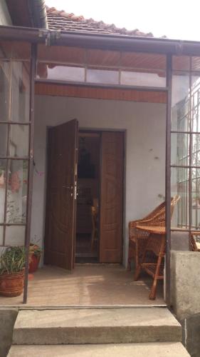 an open door of a house with a piano in it at Villa Svalyavа in Svalyava