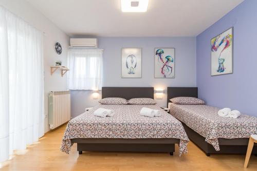 Postel nebo postele na pokoji v ubytování Apartment Anton, Fazana