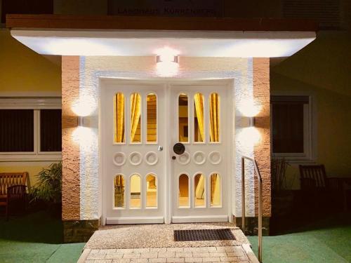 a front door of a house with lights on it at Landhaus Kürrenberg in Mayen