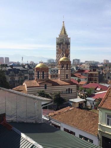 a view of a city with a clock tower at Cozy Guest House in Old Batumi in Batumi