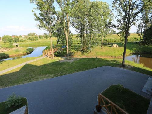 an aerial view of a driveway with a river at Pensjonat Bajdarka in Suraż