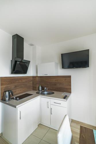 Kuchyň nebo kuchyňský kout v ubytování Apartamenty i Pokoje Gościnne Relax