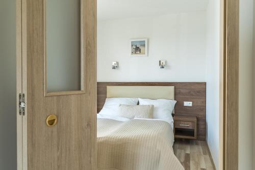 Postel nebo postele na pokoji v ubytování Apartamenty i Pokoje Gościnne Relax