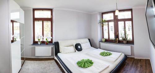 Ένα ή περισσότερα κρεβάτια σε δωμάτιο στο DD Apartments