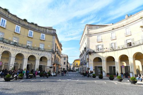 a street in a city with buildings and people at B&B A due passi in Caserta