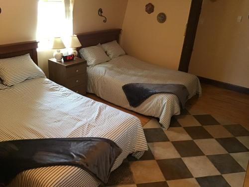 Ένα ή περισσότερα κρεβάτια σε δωμάτιο στο Chez Odette, suite international