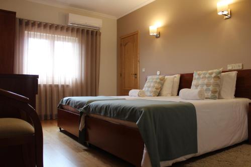 Ein Bett oder Betten in einem Zimmer der Unterkunft Casa da Seara