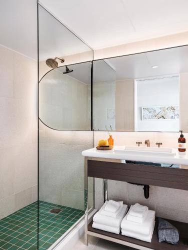 a bathroom with a sink and a shower at The LINE Austin in Austin