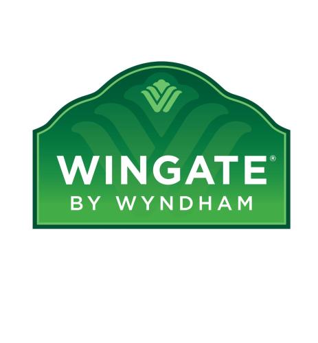 a green hedge with the words winrade by wyrham written on it at Wingate by Wyndham Brighton in Brighton