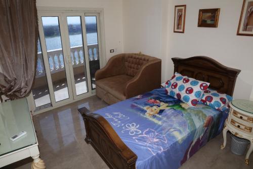 Postel nebo postele na pokoji v ubytování Maadi, Direct Nile river View From all Rooms