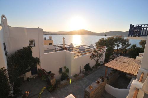 an aerial view of a building with a view of the water at Votsalo Apartments in Naousa