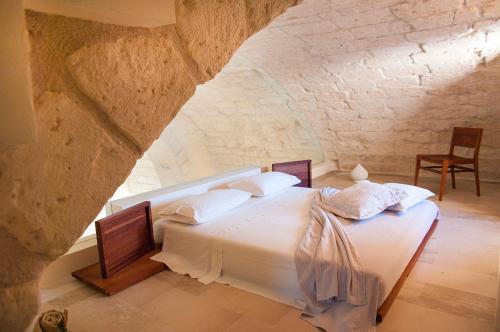 Voodi või voodid majutusasutuse Masseria La Millenaria toas