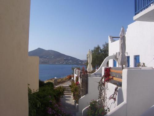 a view from a balcony of a building with a view of the water at Votsalo Apartments in Naousa