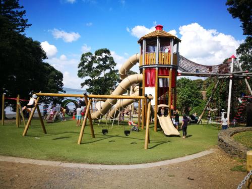a park with a playground with a slide at Monique's Rose Room Prvt BthRm AC TV in Auckland