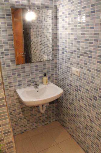 a bathroom with a sink and a mirror at Sunny Apartments, Historical Centre Alicante in Alicante