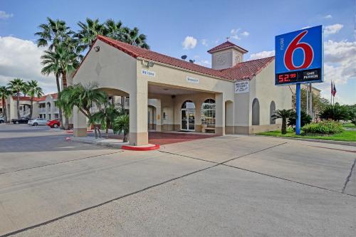 a gas station with a sign in front of it at Motel 6-Edinburg, TX in Edinburg