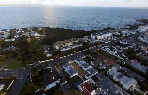 an aerial view of a town next to the ocean at Perla in Hermanus