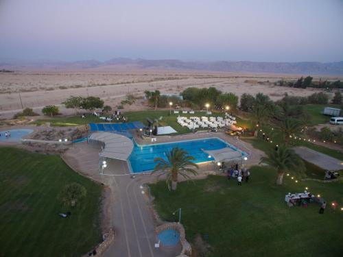 an aerial view of a resort with a pool at Lotan Desert Travel Hotel in Naẖal Ya‘alon