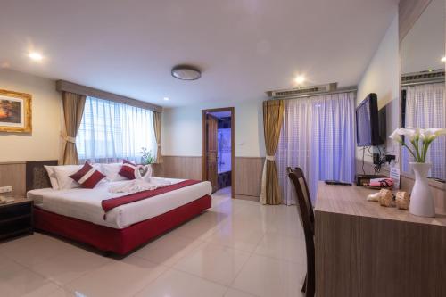 Ένα ή περισσότερα κρεβάτια σε δωμάτιο στο Gusto Pratunam Hotel
