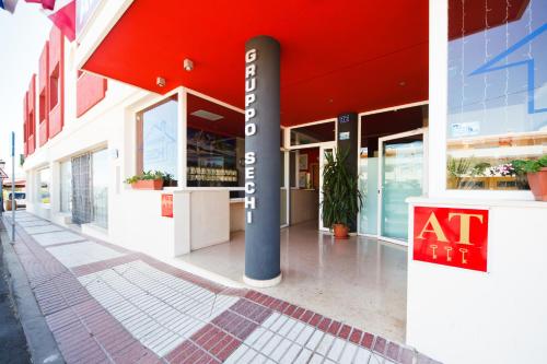 an entrance to a building with a red roof at Aparthotel Autosole in Estepona
