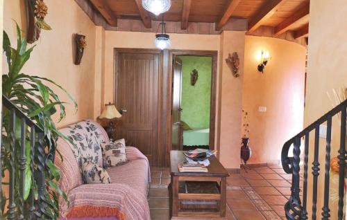 a living room with a couch and a table at El Algarrobo by CasaTuristica in Algatocín
