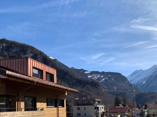 a house with a view of a mountain at Ferienapartment Landhaus 4U Meiringen in Meiringen