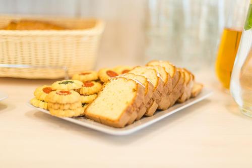 a plate of bread and banana sandwiches on a table at SOLAVO HOME&TRAVEL in Solec-Zdrój