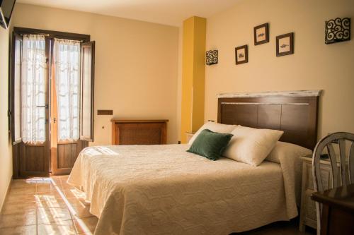 A bed or beds in a room at Posada Marina
