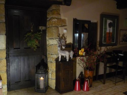 a room with a door and a stone wall at Casa Rural La Retuerta in Nava