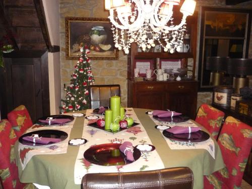 a dining room table with a christmas tree on it at Casa Rural La Retuerta in Nava