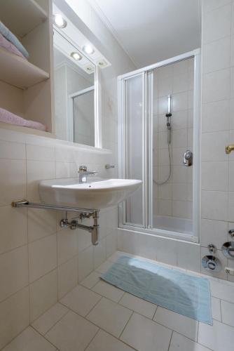 a bathroom with a sink and a shower at Haus Gebhard in Reutte