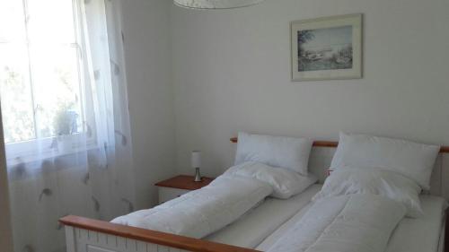 Postel nebo postele na pokoji v ubytování Ferienwohnung Sonneneck