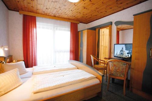 Postel nebo postele na pokoji v ubytování Landgasthof Piroutz