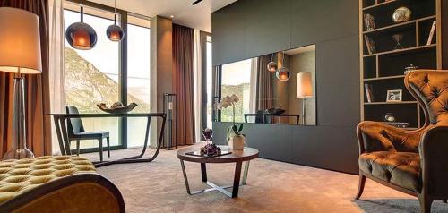 a living room with a couch and a table at Grand Hotel Campione in Campione dʼItalia