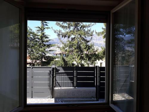 a window with a view of a fence at Casa Marilla in Malcesine
