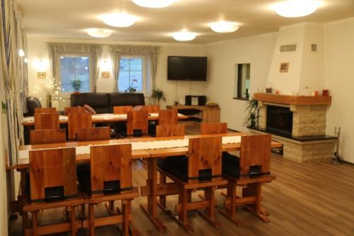 a living room with a large table and chairs at Chalupa Semafor in Dolní Malá Úpa