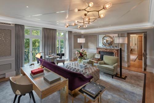 a living room with a couch and a table at Mandarin Oriental Hyde Park, London in London