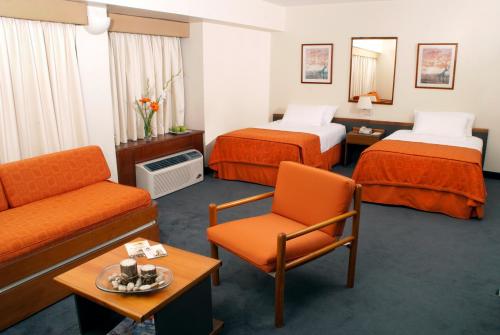Χώρος καθιστικού στο Hotel Cristina Suites