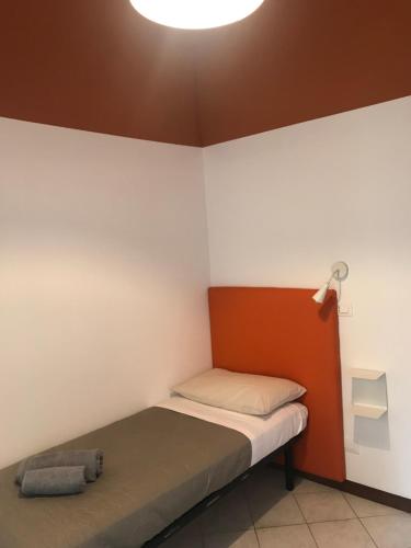 Ένα ή περισσότερα κρεβάτια σε δωμάτιο στο marconi 22 rooms
