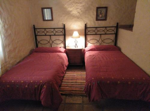 Ένα ή περισσότερα κρεβάτια σε δωμάτιο στο Casas Rurales El Viejo Castaño - Valle Del Genal