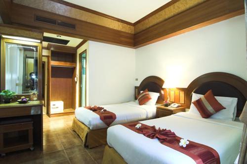Postel nebo postele na pokoji v ubytování PS Hotel Phuket Patong - SHA Plus